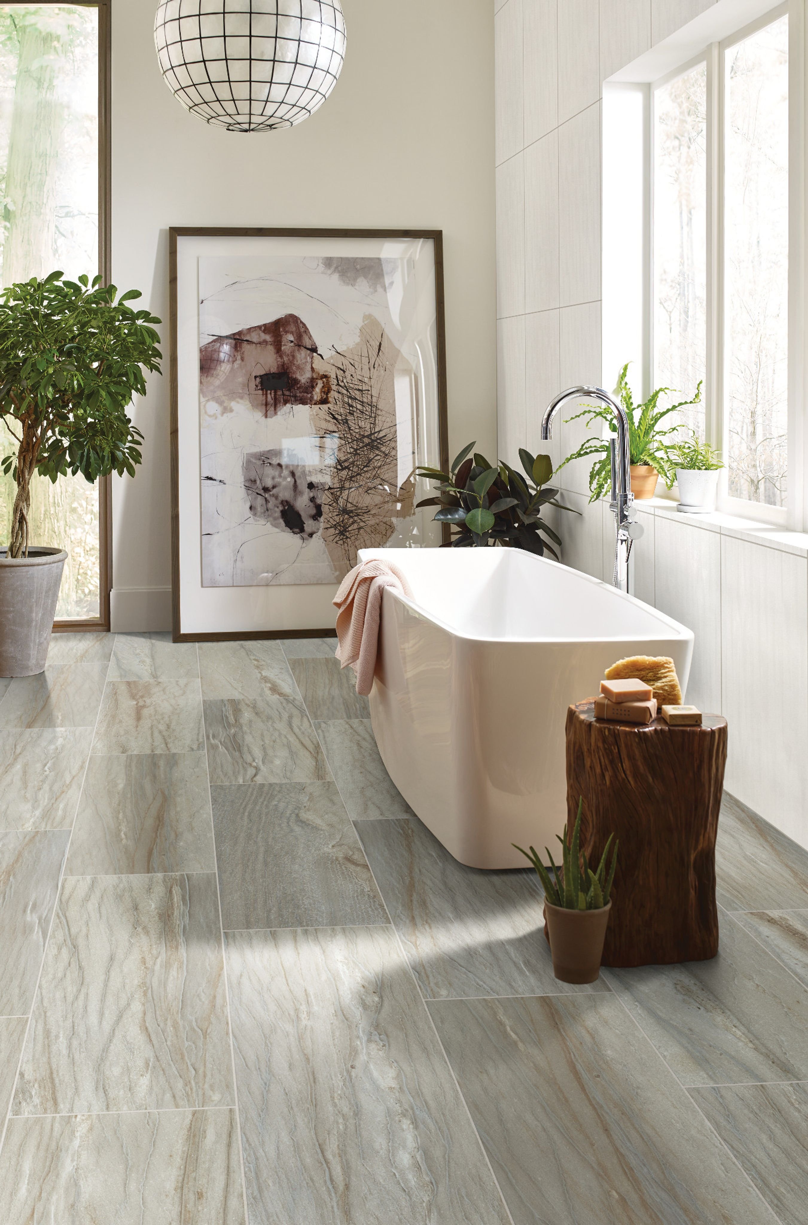 standalone beige tub on tile floors - B D Flooring Inc