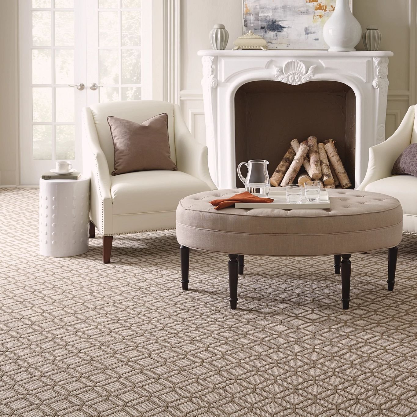 two white chairs and a round table in front of a chimney - bdflooringinc